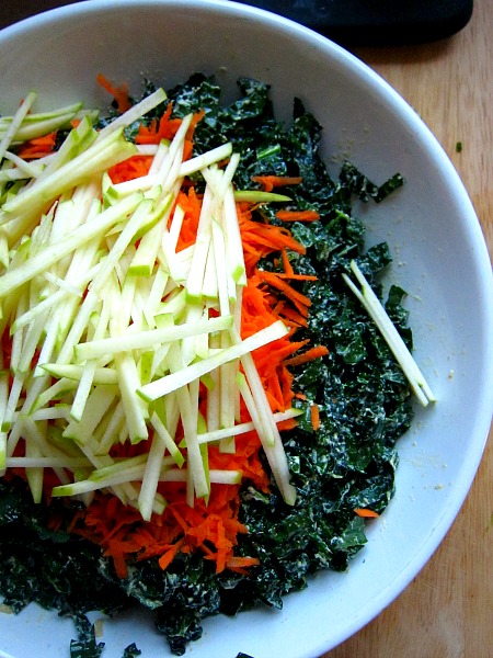 &nbsp;Put all that chopped up Kale into a bowl, add the dressing and mix it into the kale. &nbsp;I use my clean hands to &nbsp;massage it into it. &nbsp;Take a peeled carrot and shred it on a cheese grater, put it on top of kale. take your&nbsp;apple batons and put those on top as well.